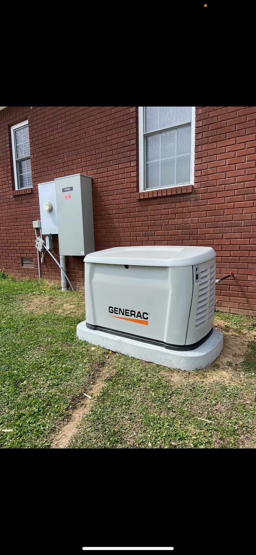 Frost Electric electrician working on a residential electrical panel in Haleyville Alabama